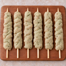 Large Mediterranean Chicken Kebabs 125g arranged on a wooden board