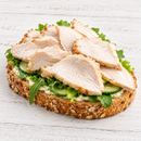 Open-faced seeded sandwich topped with Steggles oven-roasted sliced chicken, cucumber and fresh salad greens.