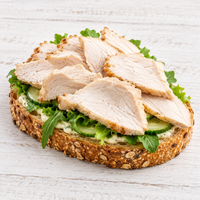 Open-faced seeded sandwich topped with Steggles oven-roasted sliced chicken, cucumber and fresh salad greens.