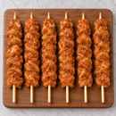 Raw Large Portuguese Chicken Kebabs 125g with Portuguese-style seasoning on wooden board – Triple C Poultry