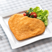 Superior XL 280g crumbed chicken breast schnitzel on a white plate with lettuce and cherry tomatoes; serving suggestion.