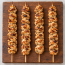 Cooked XL Oregano Chicken Kebabs 130g on wooden board – Triple C Poultry